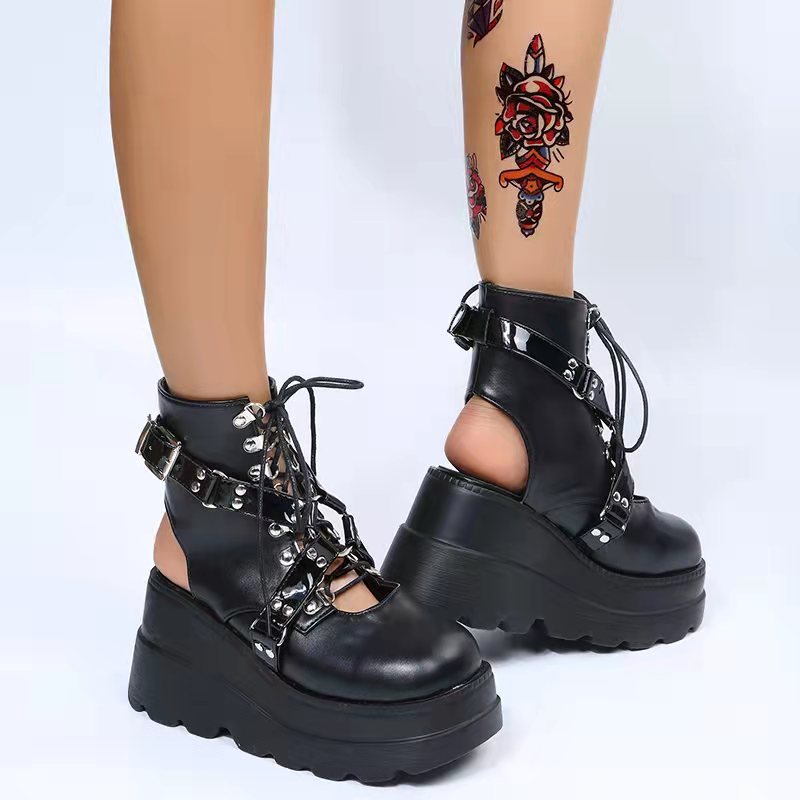 Black harness platform boots alternative darkwear women close up buckle strap and chunky sole detail