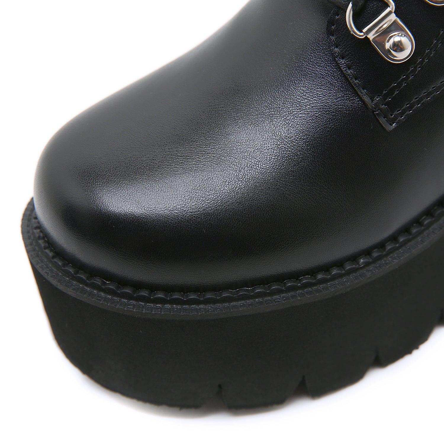 Black studded boots darkwear fashion women close up silver square rivet strap detail