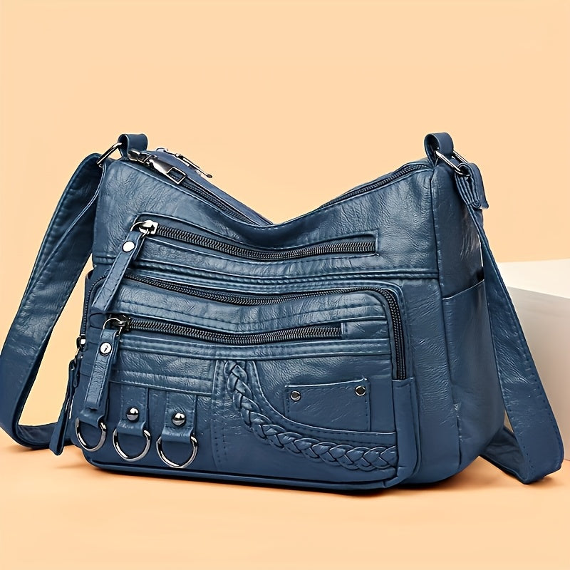 Blue: Multi-pocket quilted PU shoulder bag in blue from Alternative Darkwear