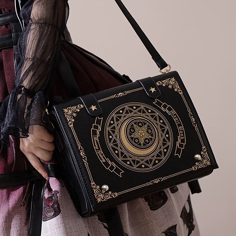 Gothic spellbook crossbody bag in black faux leather with celestial moon embossing and gold occult detailing from Alternative Darkwear