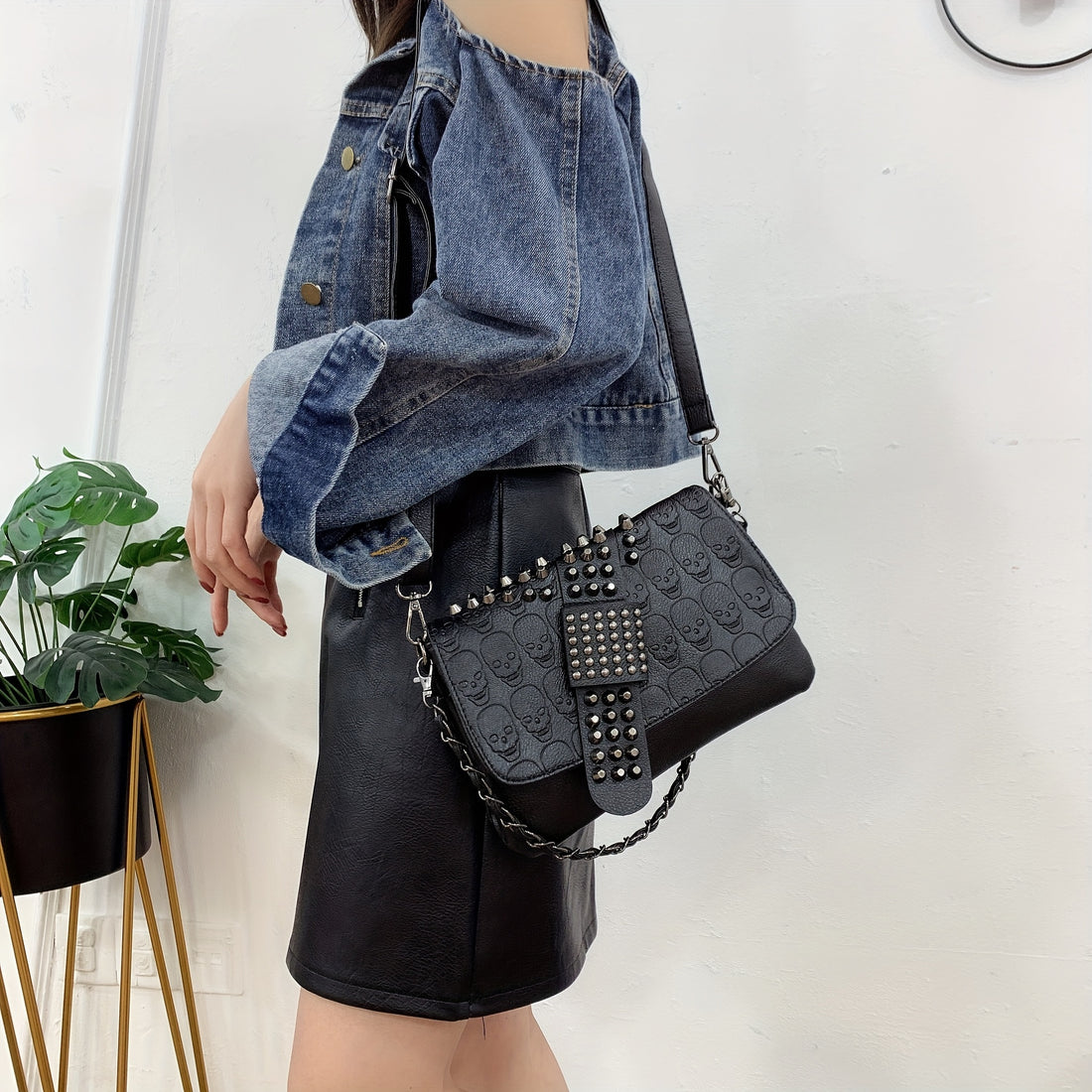 Studded skull rivet crossbody bag in black worn crossbody with adjustable strap from Alternative Darkwear
