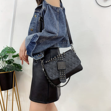 Studded skull rivet crossbody bag in black worn crossbody with adjustable strap from Alternative Darkwear
