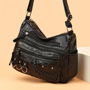 Black: Multi-pocket quilted PU shoulder bag in black with edge paint finish from Alternative Darkwear