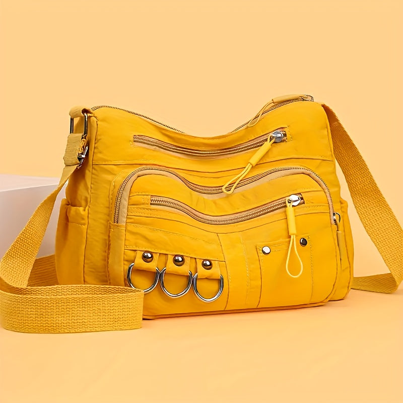 Multi-pocket hobo crossbody bag in yellow with D-ring hardware from Alternative Darkwear