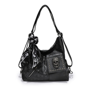Gothic skull embossed hobo shoulder bag in matte black PU leather with tassel hardware and multi-strap options from Alternative Darkwear