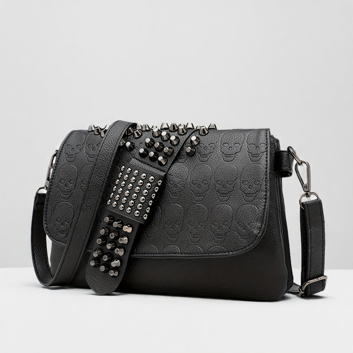 Front view of studded skull crossbody bag showing rivet hardware and skull centerpiece from Alternative Darkwear