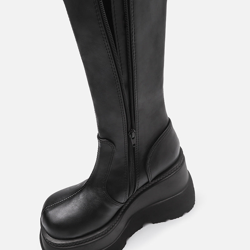 Black_platform_boots_alternative_darkwear_women_on_leg_angled_view_chunky_heel_and_sole